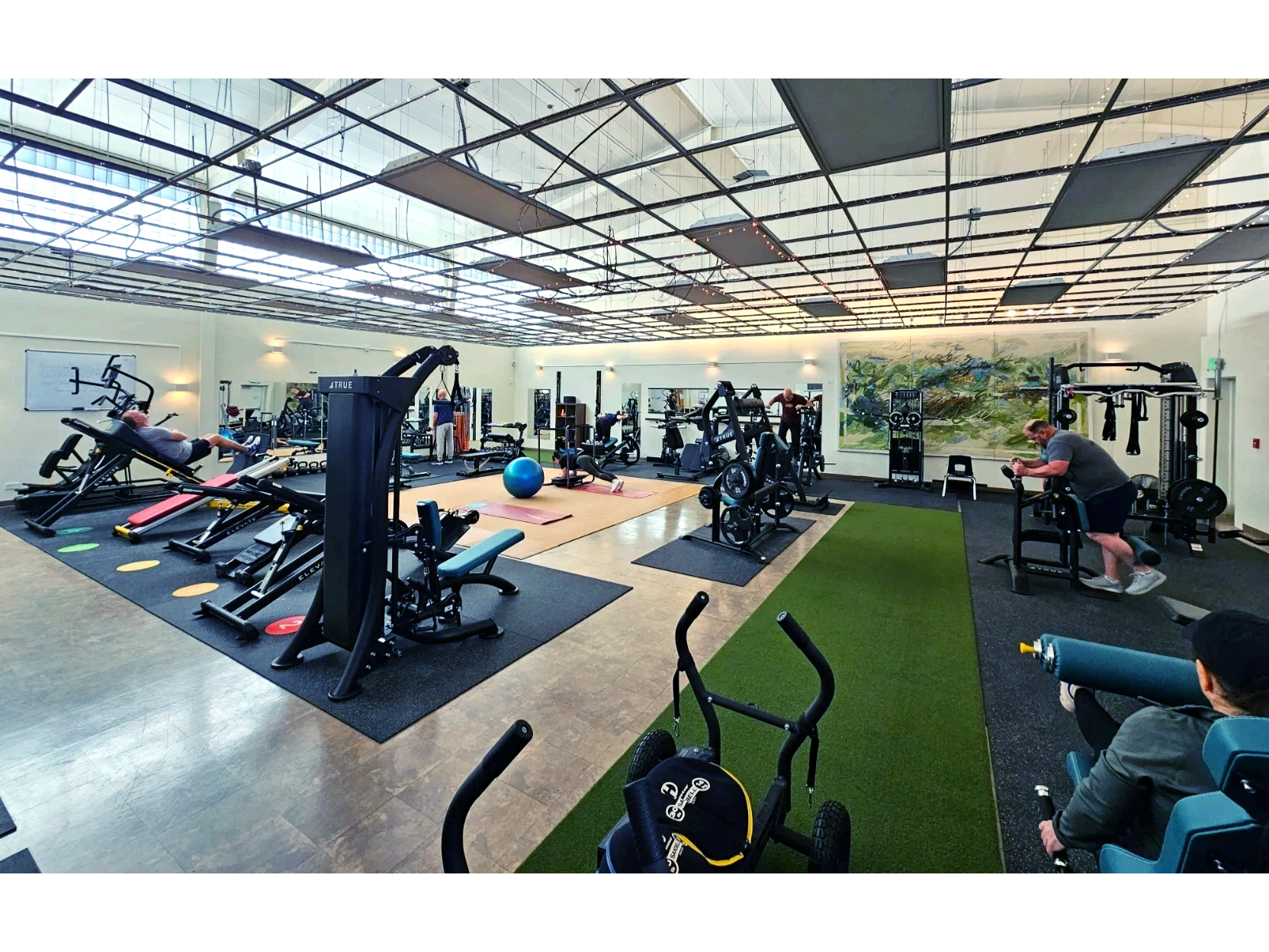Wildfire Fitness studio. Equipment and members performing a circuit class.