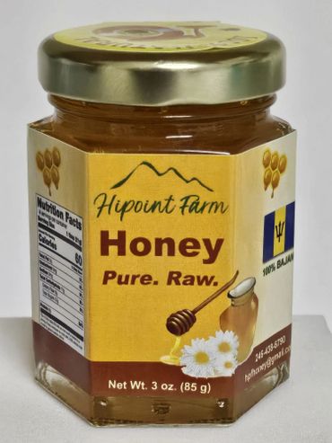 Jar of Hipoint Farm Pure Raw Honey with a golden lid and floral design.
