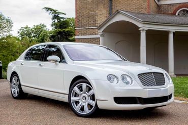 white Bentley wedding car