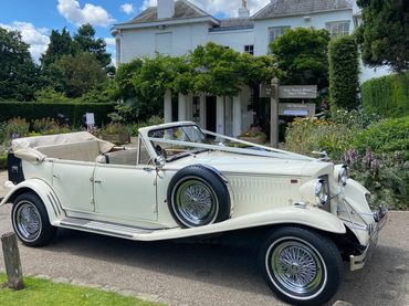 open top vintage wedding car