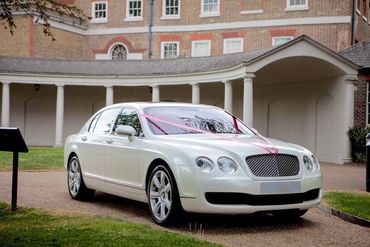 white Bentley wedding car outside Ilford registry office