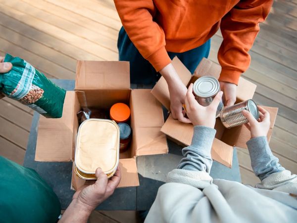 Volunteers packing community supplies