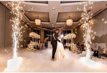 Bride and Groom dancing in the cloud along with cold sparklers effect