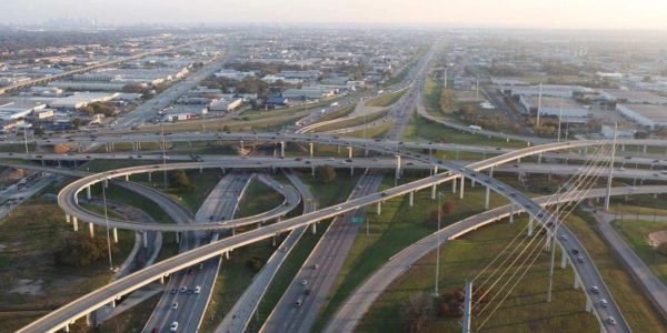 A complex highway interchange with multiple overpasses and traffic.