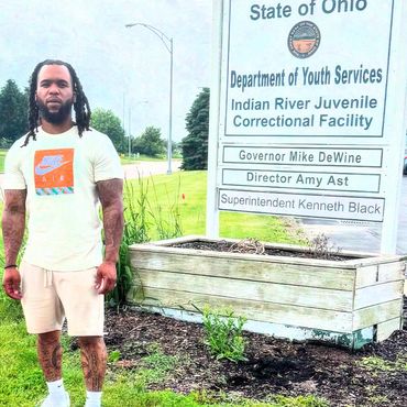 Standing outside Indian River, reminding the youth they still have a chance to change.