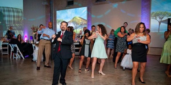 DJ George teaching a line dance during a wedding reception at Zen in Greenville, SC.