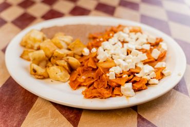 Close up image of a plate full of food in it