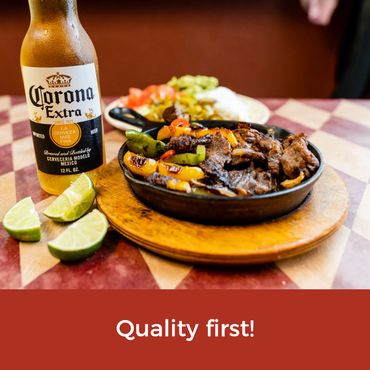 Close up image of a corona beer with a bowl of food