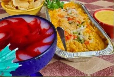 Close up image of some vessels of food kept on a table