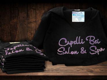 Black short-sleeve t-shirt with Capelli Bei Salon and Spa logo