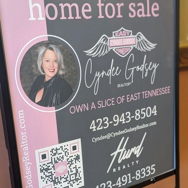 Metal holder with corrugated plastic sign for Hurd Realty