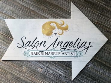 Custom arrow-shaped sign for Salon Angelia