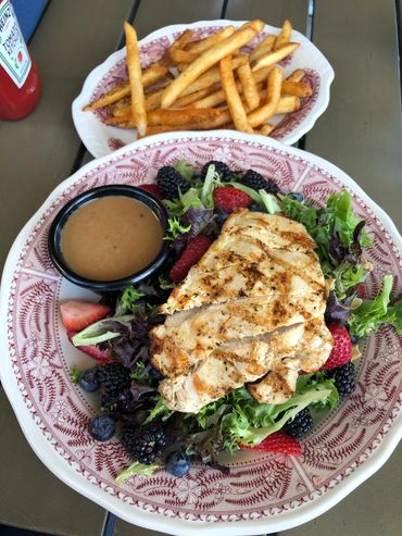 Cajun French fries and Berry almond chicken salad enjoyed on our beautiful, covered patio