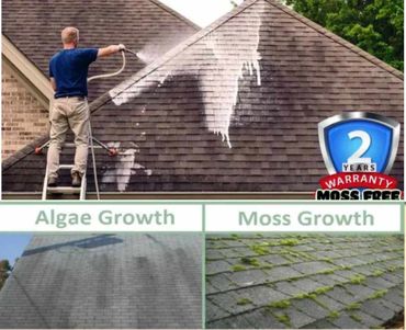 Man pressure washing a roof to remove algae and moss growth.