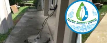 Before and after cleaning a concrete walkway using a surface cleaner.