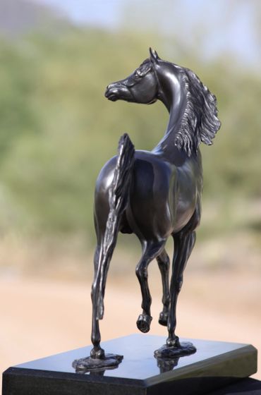 Black Arabian horse sculpture by J Anne Butler.