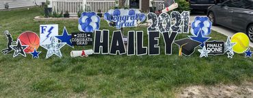 Blue Graduation yard sign greeting with basketball and softball in Indianapolis and Fishers.  