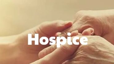 Two people holding hands, symbolizing hospice care and compassion.