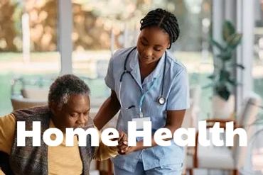 Nurse assisting elderly man in wheelchair at home.