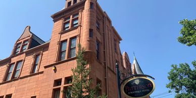 Close up side view of the Croke-Patterson and the sign for the Patterson Inn