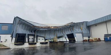 storm damaged metal building warehouse