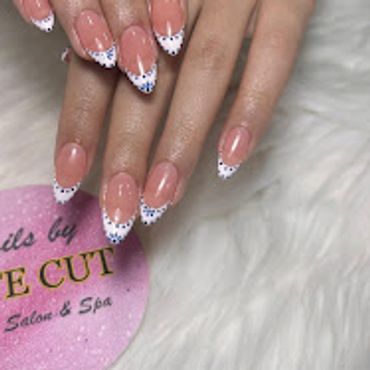French tip nails with white lace and blue glitter accents — Cute Cut Beauty Salon & Spa, Zinj Bahrai