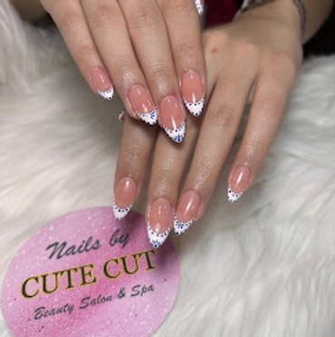 Trendy almond-shaped nails with classic white French tips and dot nail art
