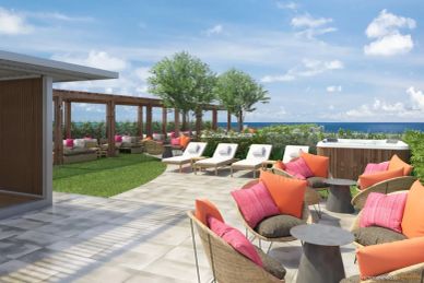 Luxurious outdoor lounge area with colorful cushions and ocean view.