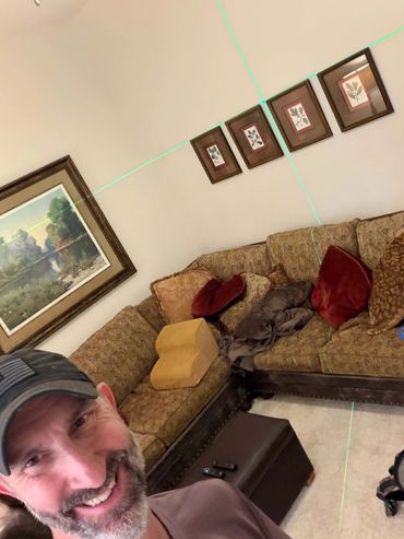 adam taylor the handyman hanging art in alden bridge, the woodlands, tx