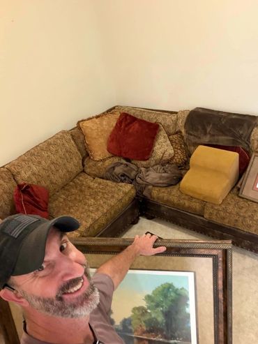 adam taylor the handyman hanging art in alden bridge, the woodlands, tx