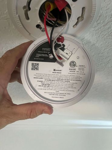 Adam Taylor the Handyman replacing a smoke detector in College Park, The Woodlands, TX