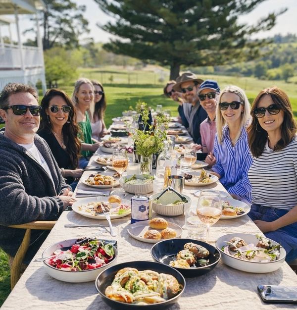 Private chef dining experience at a long-table dinner in Margaret River, guests enjoying a banquet