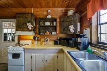 Our truly authentic waterfront log cabins sit creekside