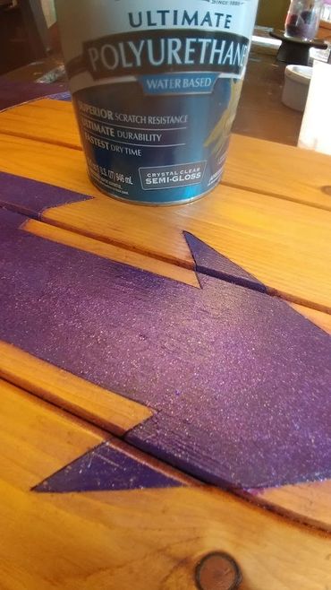 Symbol inlay with high gloss purple paint.