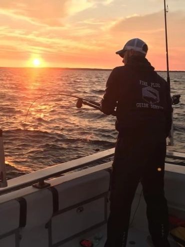 Captain Alex getting the lines ready during a beautiful sunrise.