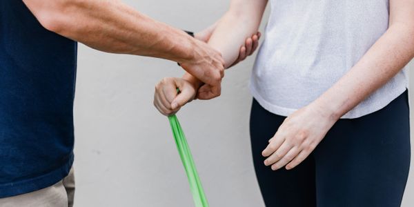 Showing a client theraband exercises