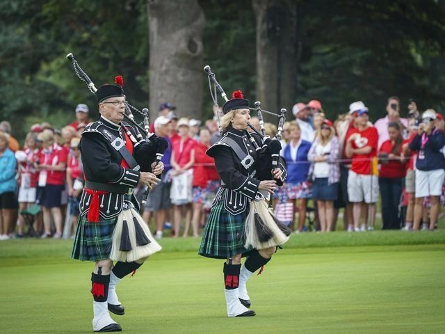 Bagpiper Theresa Taylor and myself piping up the fairway at the Des Moines Golf and Country Club for