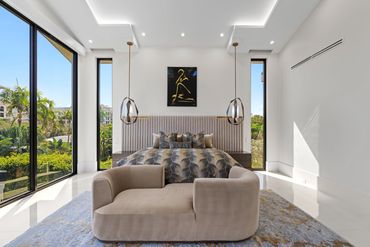 primary bedroom. master bedroom. large pendants