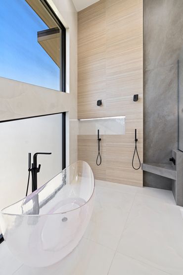 shower wet room. double heads. shower bench. clear tub. soaking acrylic tub