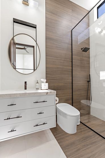 guest bathroom. wood porcelain tile. floating vanity