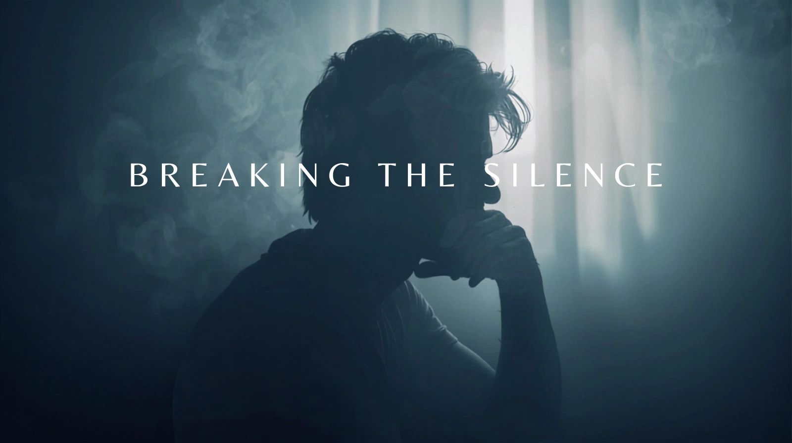 Silhouetted person in deep thought with text 'Breaking the Silence' overlaid.