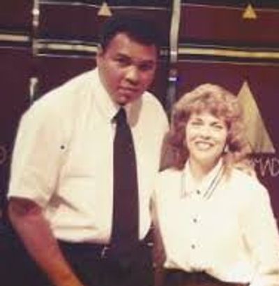 Carolyn Finch with international sports hero, Mohamed Ali.