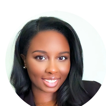 Smiling woman with long black hair and pearl earrings.