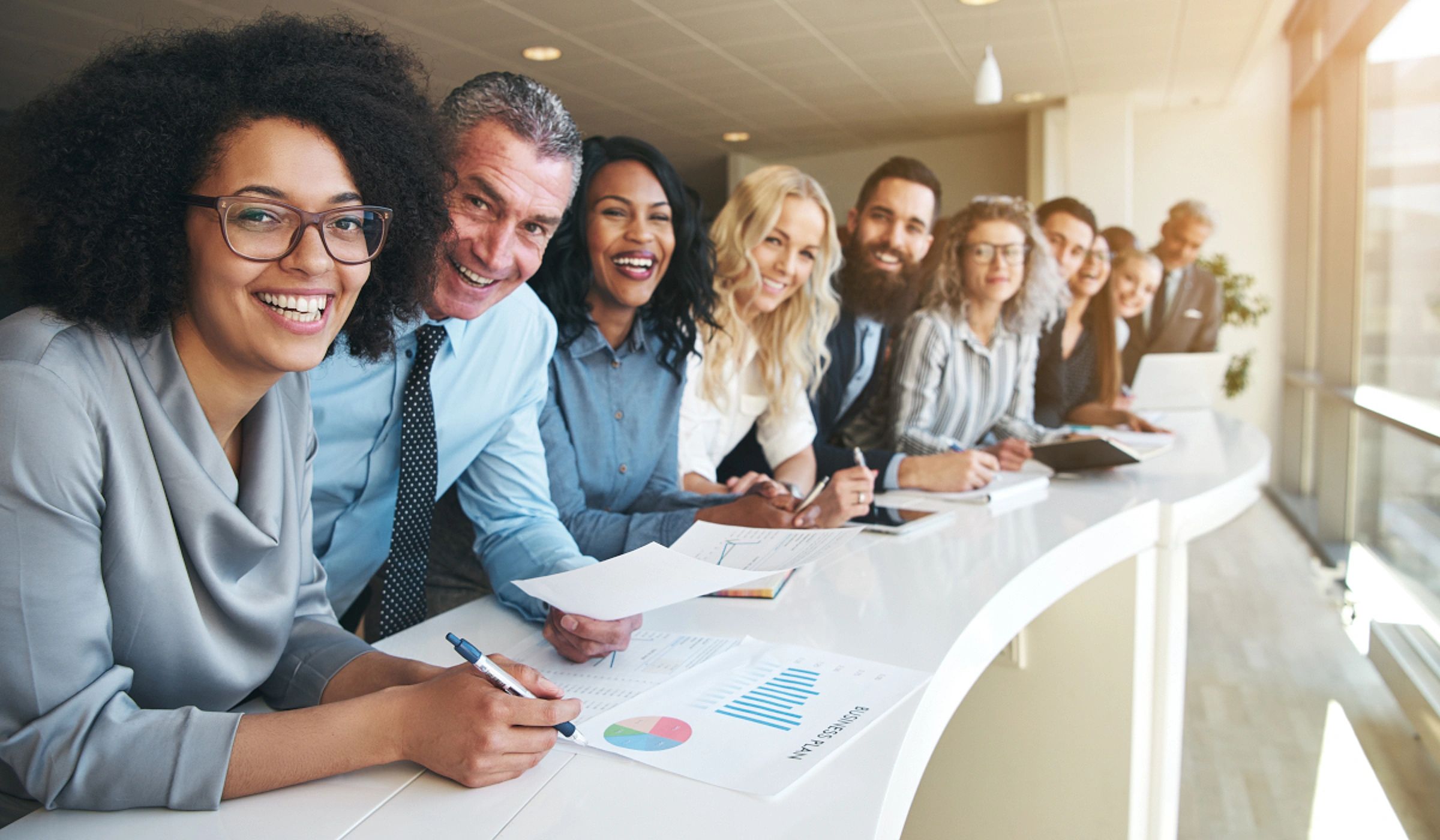 Smiling insurance professionals meeting together