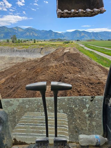 Excavating berm for gravel pit. Wyoming