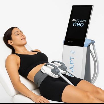 Woman undergoing EMSculpt Neo body contouring treatment on abdomen.
