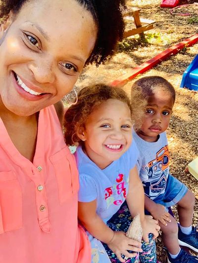 Stephanie Joyner on the playground with students
