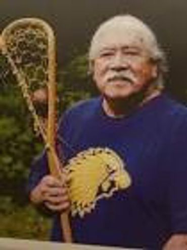 Alfie Jaccques is a traditional Iroquois stick maker. Here he's holding a traditionally made wooden
