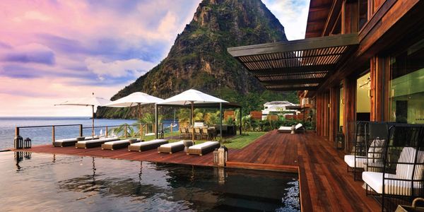 Private villa with pool on beach at Viceroy Sugar Beach resort overlooking one of the Pitons.