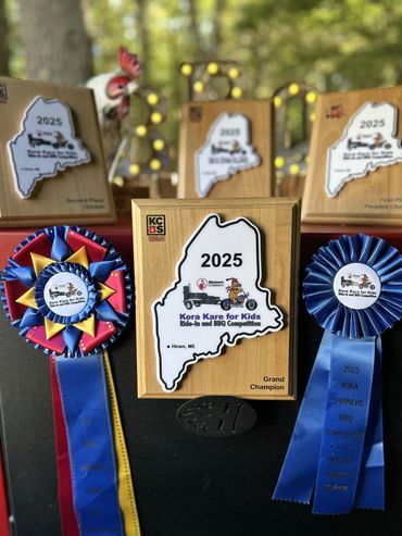 2025 Kora Kare for Kids BBQ competition trophies and ribbons.